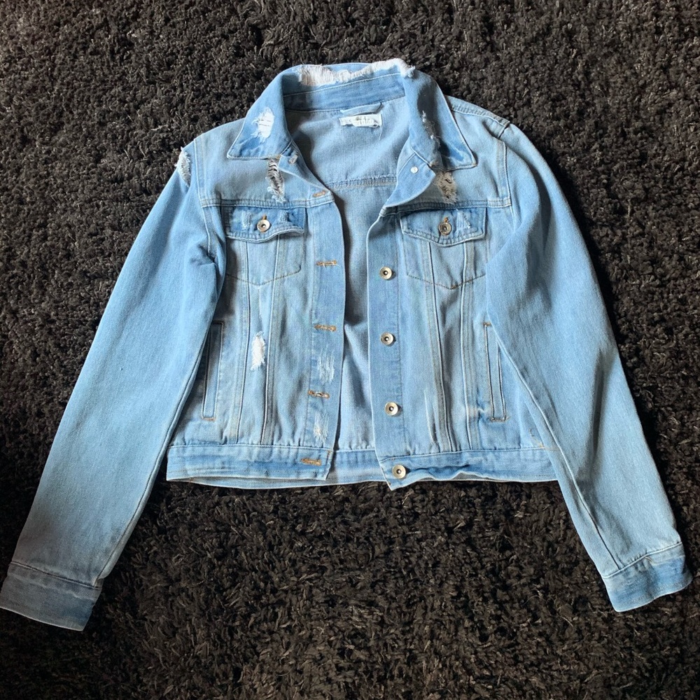 Ripped light wash denim jacket, NEVER WORN.